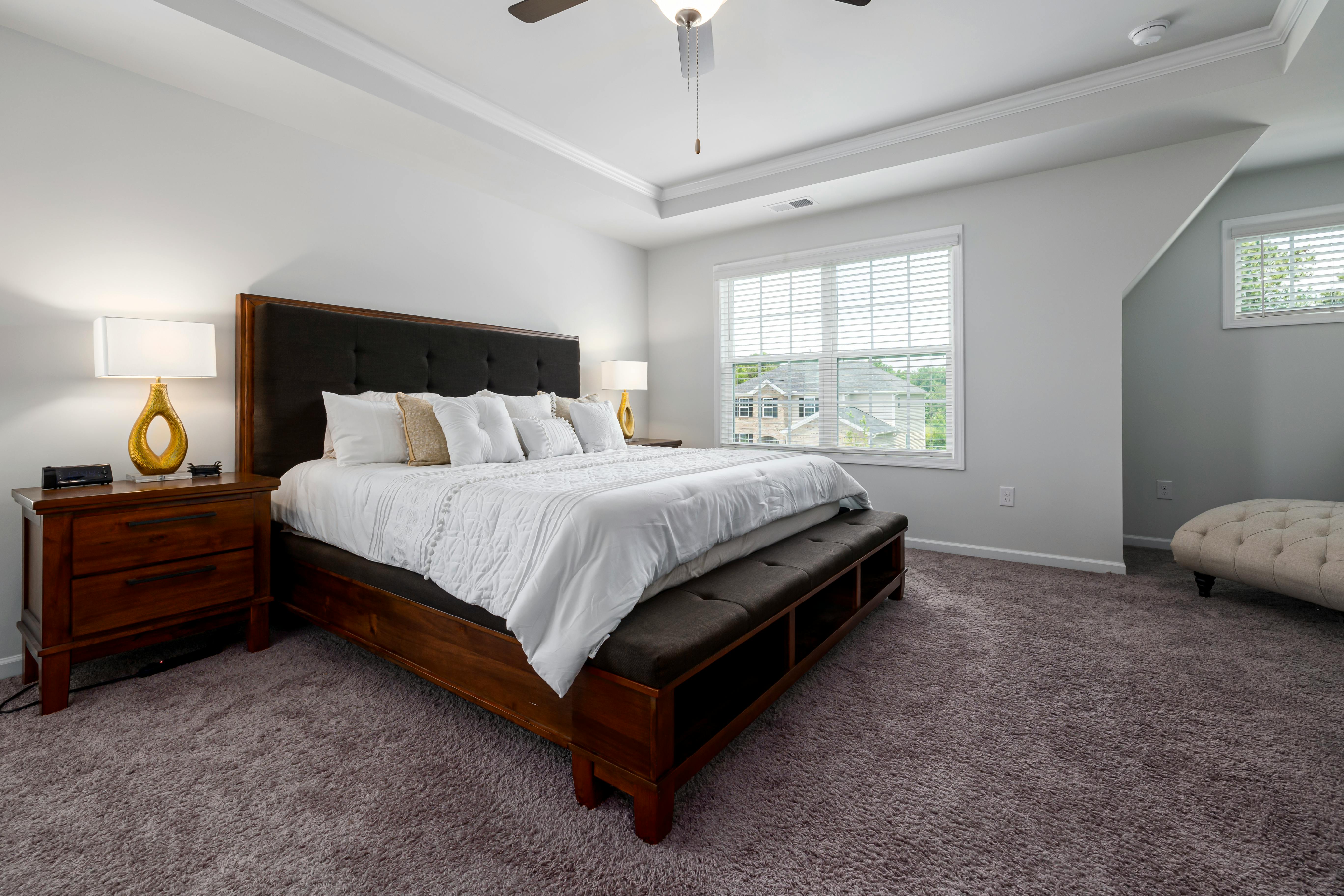 Assembled queen size bed frame in a bedroom